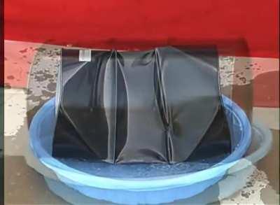 Video of a steel drum imploding