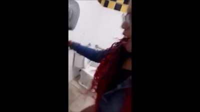 NSFW Woman spits and urinates all over gas station