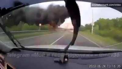 Russian missile/shell,
aiming at the Wagner convoy, hits nextto a highway.(Voronezh,Russia/June
24,2023)