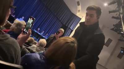 Sheriff Robert Norris attempts to drag one of his constituents out of a public town hall meeting, and threatens to pepper spray her if she does not comply. He claimed he wasn’t acting in his official capacity, but he was wearing a sheriff's hat and his ba