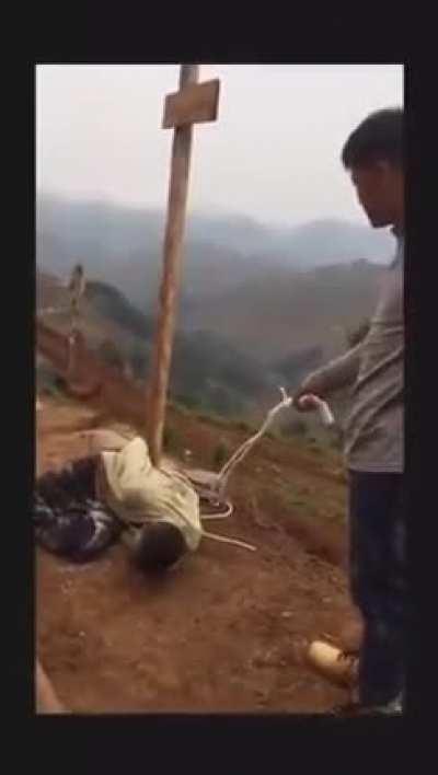 Chinese Mine Boss in Africa, whips a worker for being late on site.