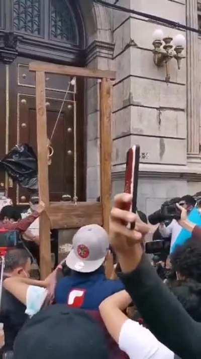 Guetemalans bring a guillotine to Congress. A fucking guillotine. My heroes.