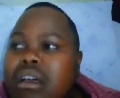 WCGW playing with a tiny instrument while laying down