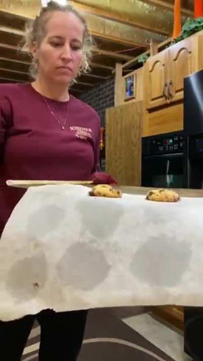 Woman tries showing the cookies that she just Baked