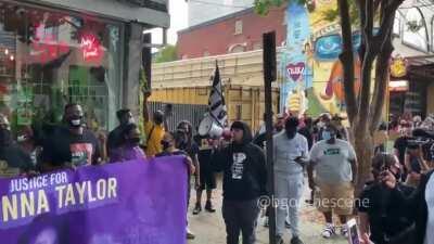 BLM protesting outside of a Cuban-immigrant-owned restaurant in the Nulu neighborhood which had been threatened last month after refusing to meet their demands