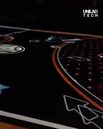 Battle-carts in London using overhead projection to provide AR and game-play.