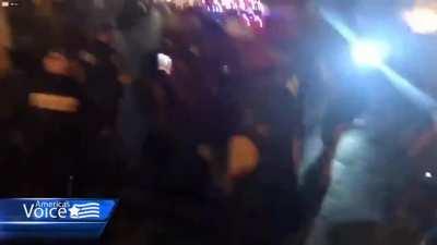 Protesters in DC yell at police, one stops in the middle of the sidewalk and cries 