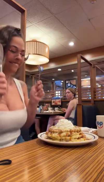 TikTok influencer does a dance celebration when receiving her food.