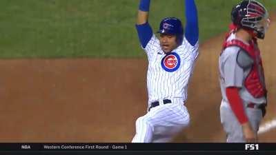 Willson Contreras sliding into home as happy as can be