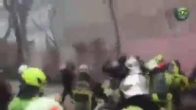 French police charging firefighters, firefighters not having any of it