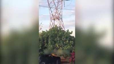 Guy Climbs a Transmission Tower