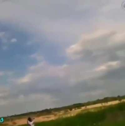 Throwing a copper wire-wrapped rock at a power line