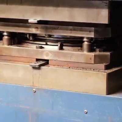 A vinyl record being made.