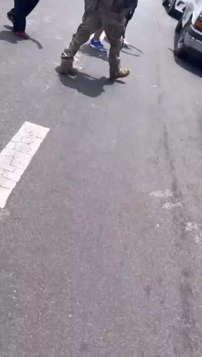 Federal Agents attempting to clear community members protesting ICE raid with tear gas