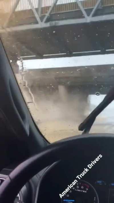 The moment a raised truck bed slams into an overpass
