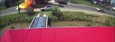 A motorcycle and a truck head-on