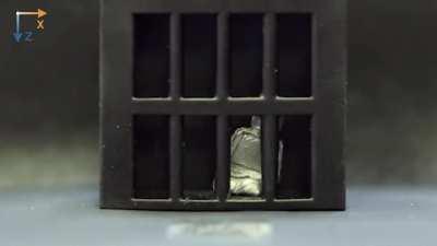 Little robot liquifies to escape cage like Terminator T1000s turns back to solid state.