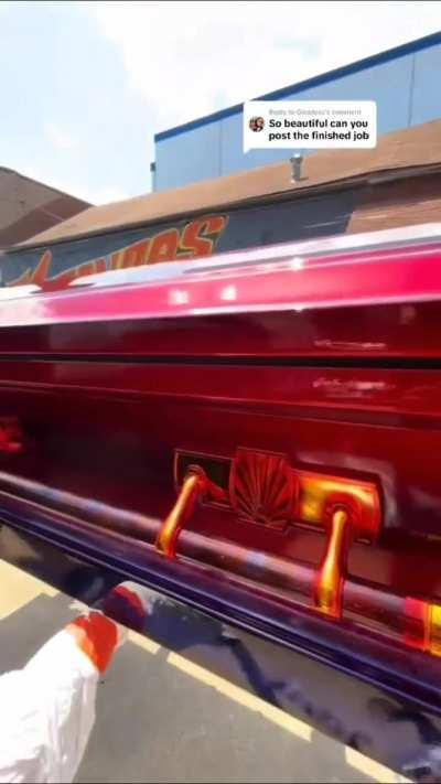 Two siblings painting their dad's coffin like he taught them how to paint cars.