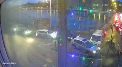 Car driving down the wrong way, on the footpath of a bridge