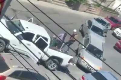 Sicarios taking a hostage and dead bodies after a shootout