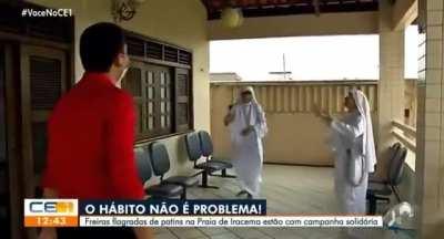 Journalist playing some volleyball with nuns
