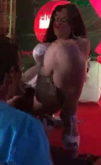 A guy blows the dancer on stage