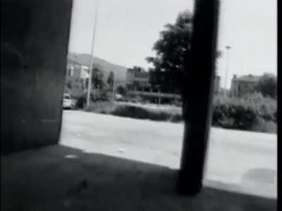 Young women laughing under sniper fire during the Siege of Serajevo (1994)