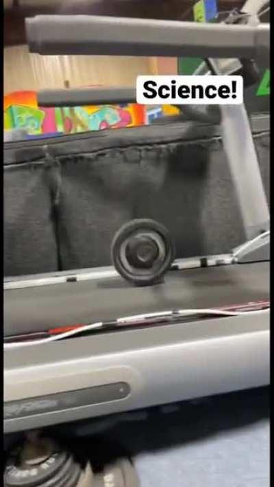 Kid doing science experiment on the treadmill