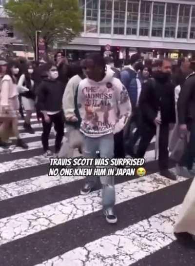 Travis Scott blocking people just going about their day in Japan