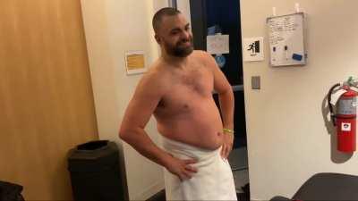 Sammy Guevara being checked on + Eddie Kingston in a towel (from Sammy's latest vlog)