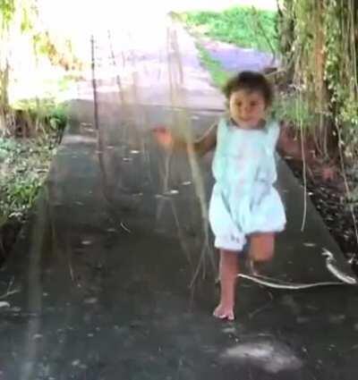 Child escapes snake bite by inches.