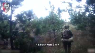 An American soldier from the 63rd Brigade's assault unit capture four Russians during a raid in the Serebryansky Forest