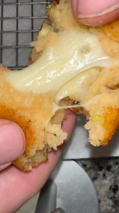 Homemade Fried mashed potato balls filled with pepper jack cheese and green onions 