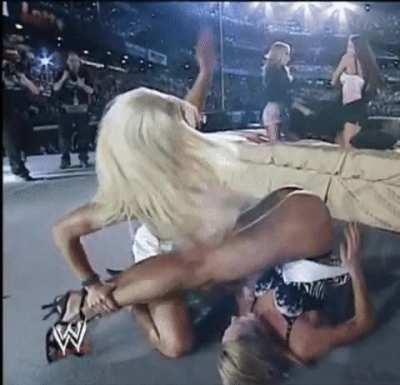 Torrie Wilson spanks Stacy Keibler's slutty ass