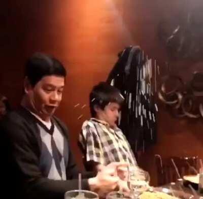 A dad opening champagne