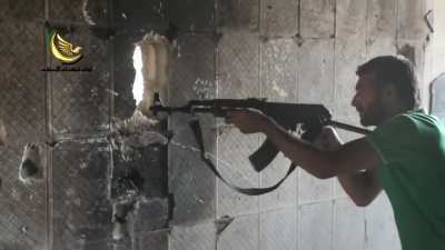Camera follows around a group of FSA Martyrs of Islam Brigade fighters as they clash with the SAA in Daraya - 9/27/2014
