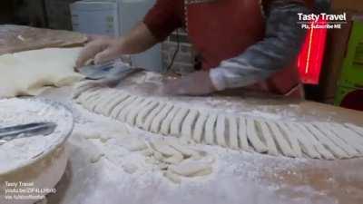 Doughnut master making twisted doughnuts