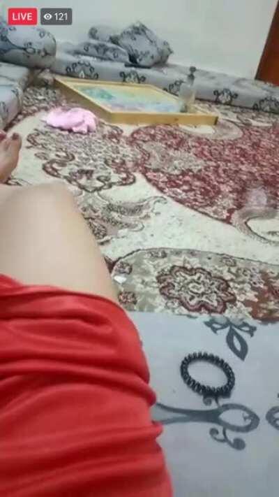 Showing bit of her pussy