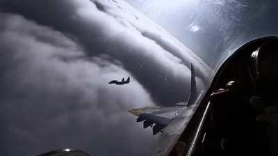 Majestic UAF MIG-29s skimming the clouds
