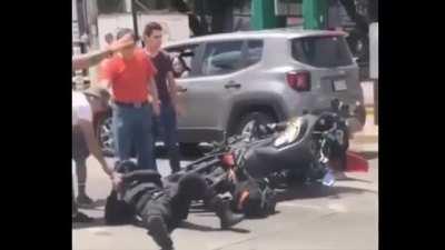 Civilian beating a motorcycle cop.