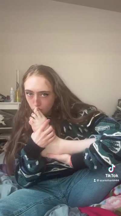 Sexy college girl kissing licking and sucking on her feet toes and soles 