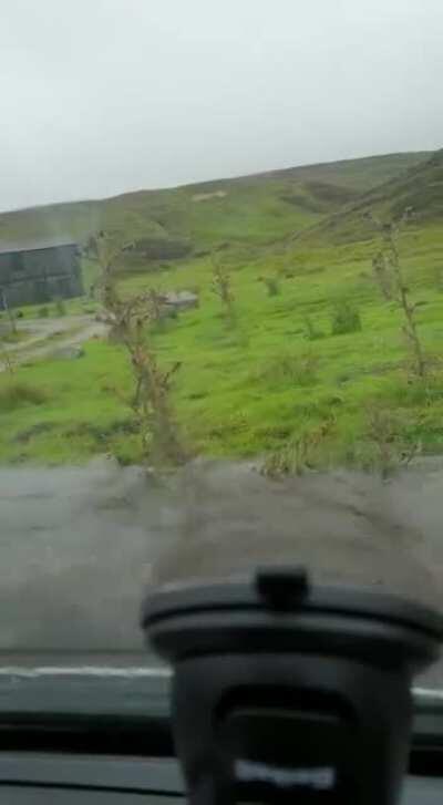 Delivery driver tries to ford a river.