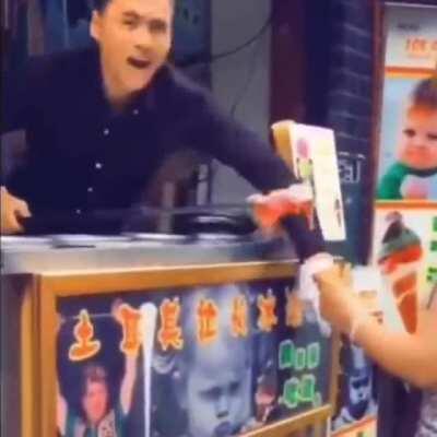 Turkish Ice cream vendor performing the trick