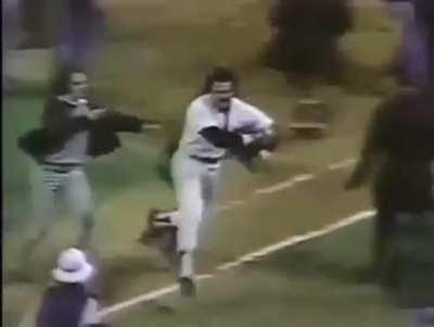 1977 World Series, fans stormed the field and Reggie Jackson tries to get to the clubhouse before the mob takes him.
