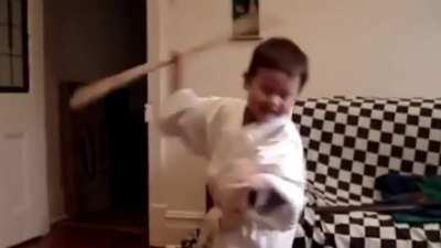 Kid training Bōjutsu with a solid wooden staff instead of a padded/rubber training staff (reposted with sound)