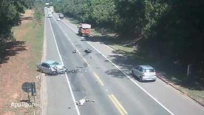 Car Crashes Into Bike While Overtaking Truck