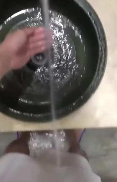 The water goes beyond the hand washing’s drain, so I can wash my feet