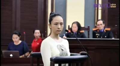 Woman in red pops out of nowhere with a surprised face before quickly disappearing in a court