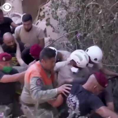 Volunteers in Beirut rescue a man who had been trapped under the rubble for over 16 hours