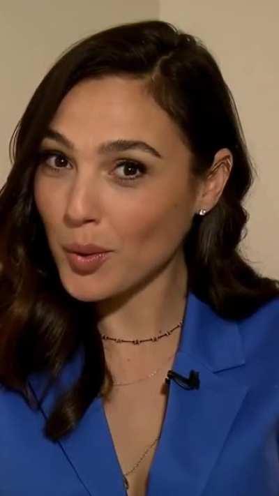 Gal Gadot smiling when she notices the boner in your pants